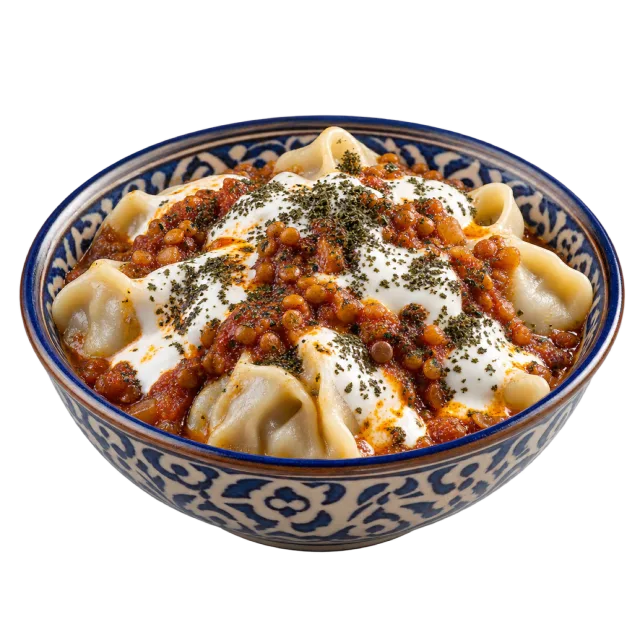 Dumplings topped with a red-brown sauce, white yogurt-style topping and dried herbs