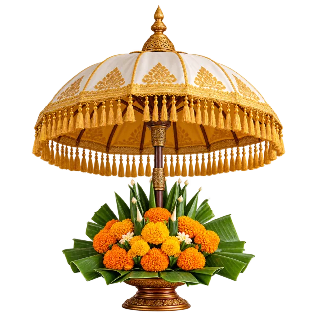 Golden fringed ceremonial umbrella above green leaves and orange flowers
