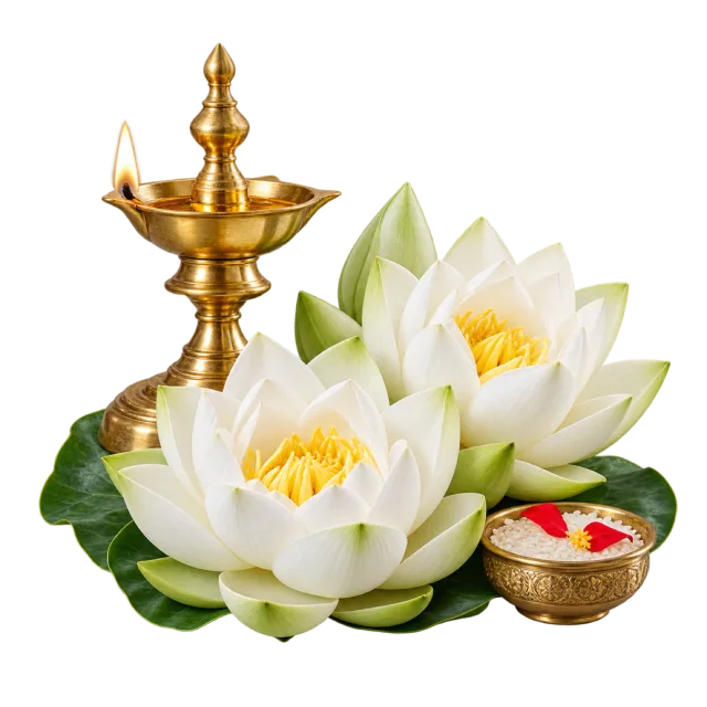 White lotus flowers beside a lit brass-colored oil lamp and a small flower bowl