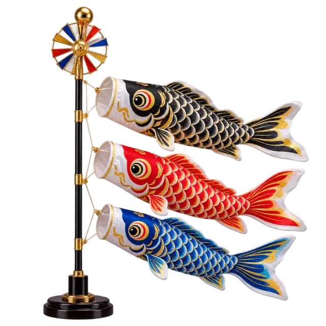 Black, red and blue carp-shaped streamers on a pole with a colorful wheel at the top