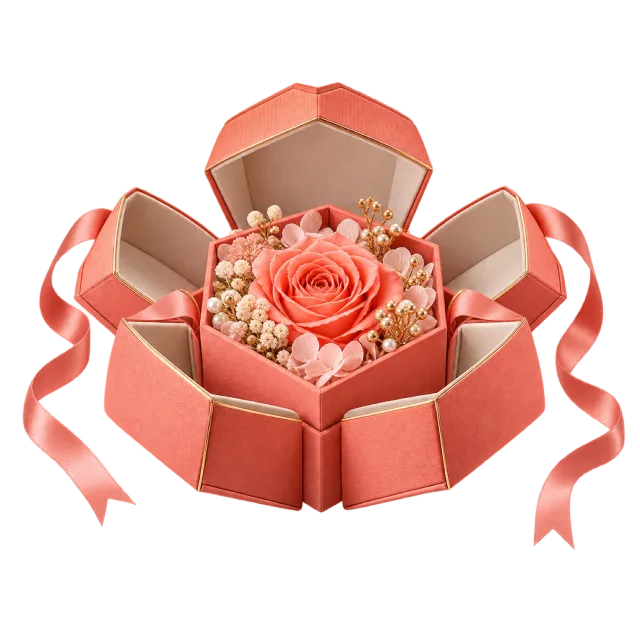 Coral folding box opened around a rose and small pale flowers