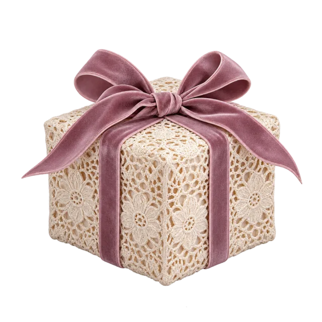 Cream lace-covered gift box tied with a mauve ribbon
