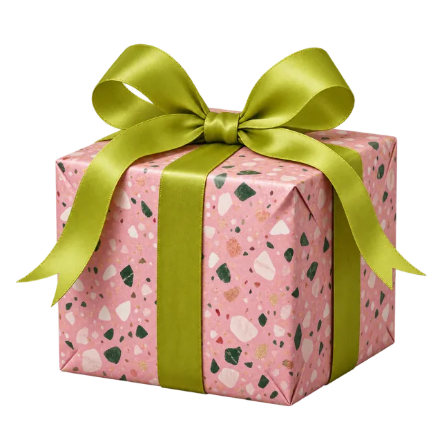 Pink terrazzo-patterned box with a chartreuse bow