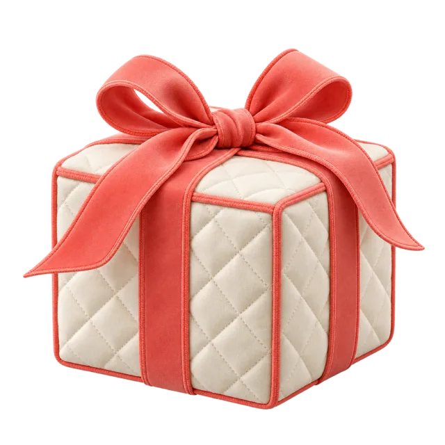 Cream quilted gift box with coral piping and ribbon