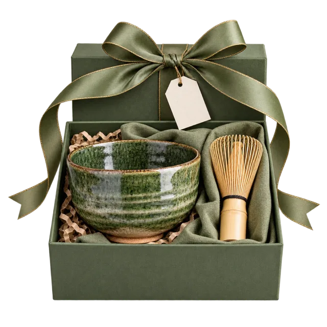 Green presentation box with a matcha bowl and bamboo whisk