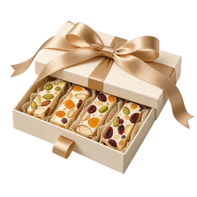 Cream drawer-style box containing nut and fruit nougat bars
