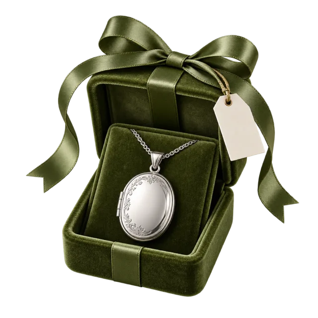 Silver-colored oval locket displayed in a green lined gift case