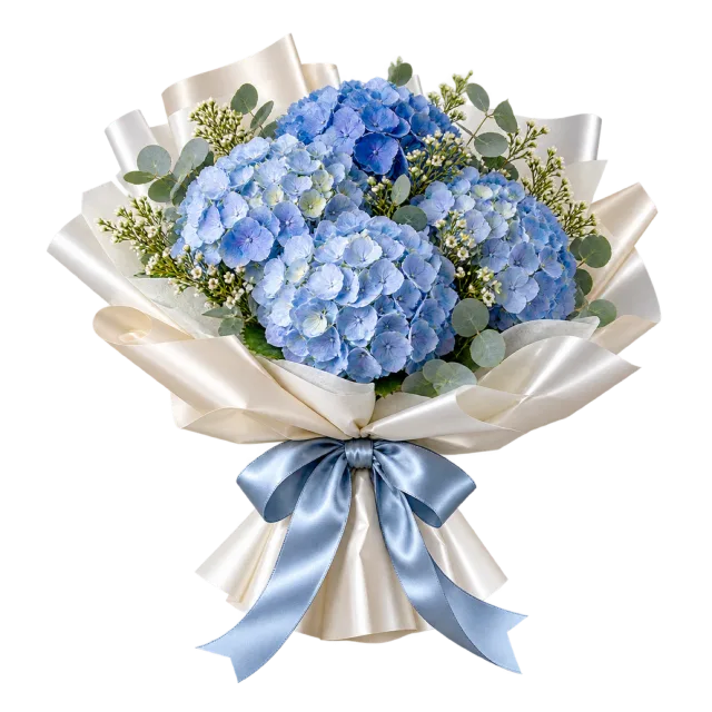 Blue hydrangea bouquet wrapped in pale paper with a blue ribbon