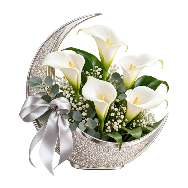 White calla lilies in a silver-colored crescent holder