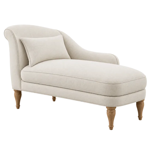 A cream chaise lounge with a curved back, matching cushion and turned wooden legs