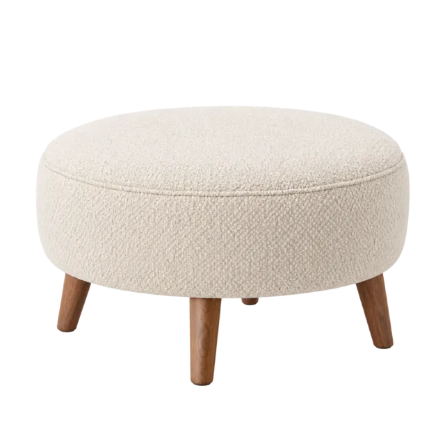 A round cream upholstered footstool with four short tapered wooden legs
