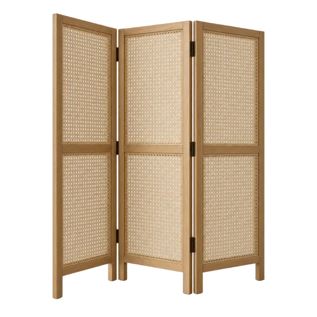 A folding room divider with three wood-framed woven cane panels