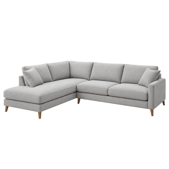 An L-shaped light gray sofa with a chaise section and short wooden legs