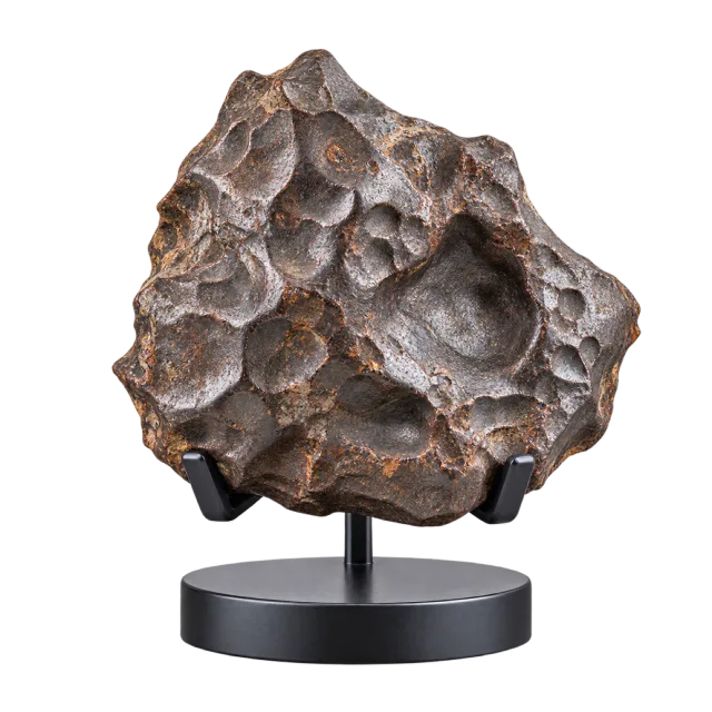 Realistic-style illustration of meteorite style rock on display stand