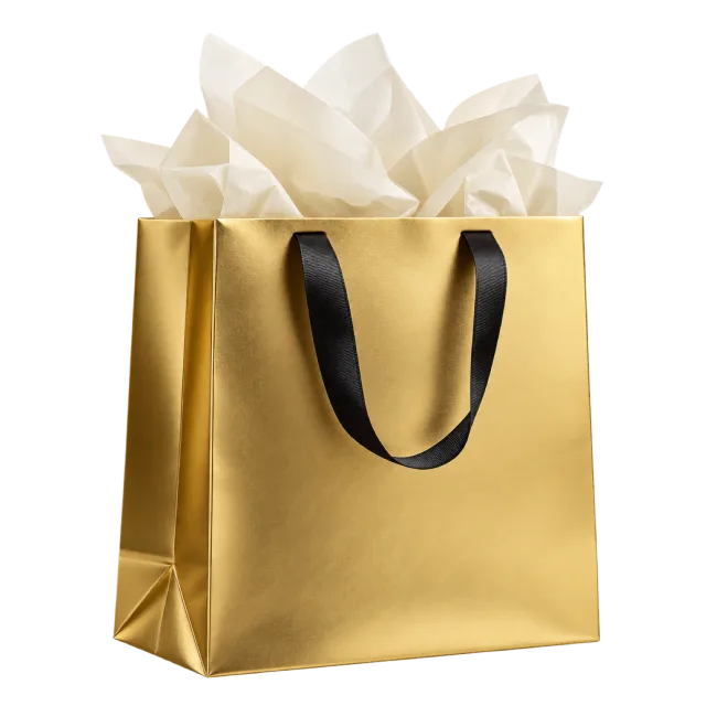 A gold paper bag with black ribbon handles and cream tissue paper