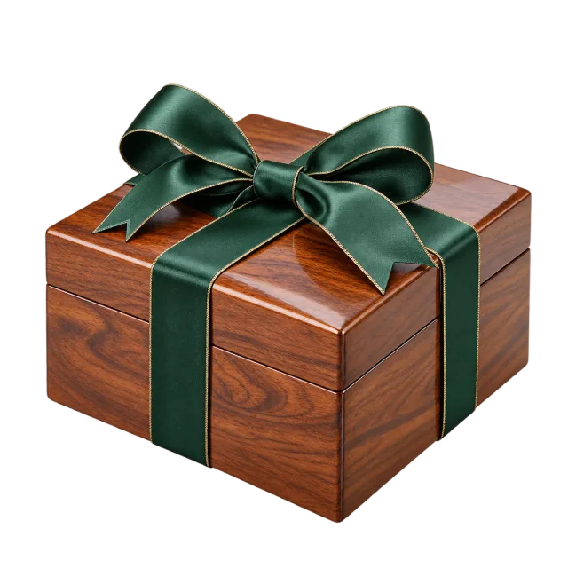 A polished wooden box wrapped with dark green satin ribbon