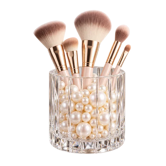 Realistic-style illustration of glass brush holder with pearl beads and brushes