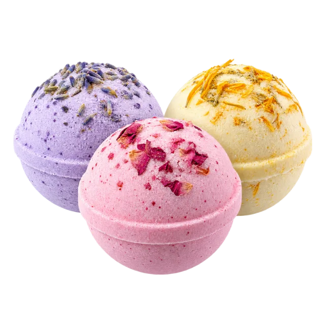 Realistic-style illustration of three pastel round bath bombs