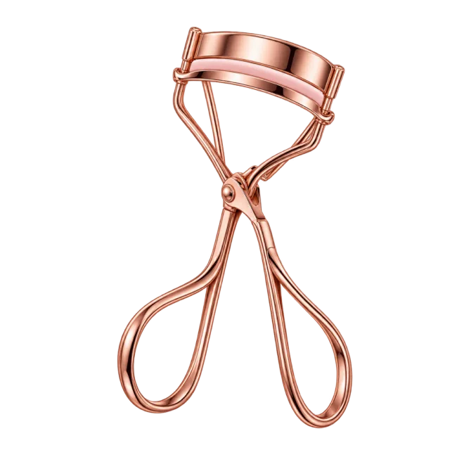 3D-style illustration of rose gold eyelash curler