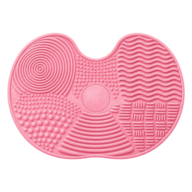 Watercolor-style illustration of pink silicone brush cleaning mat