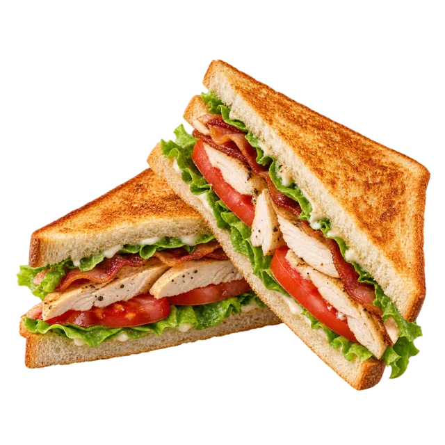 Two toasted sandwich triangles filled with lettuce, tomato and sliced meat