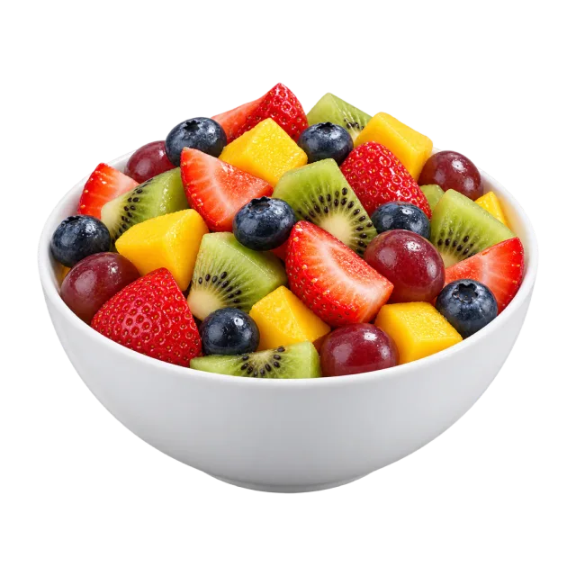 A white bowl of strawberries, blueberries, kiwi, grapes and yellow fruit pieces