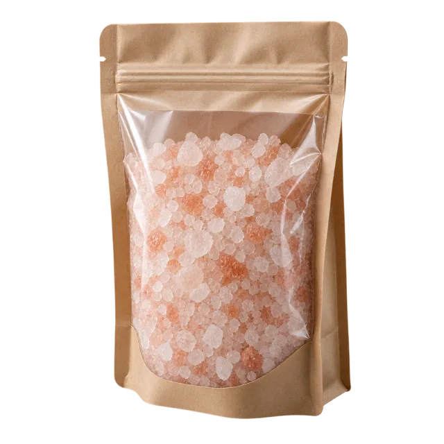 A resealable brown pouch with a clear front showing pink and white bath salts