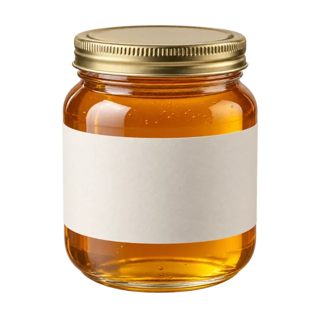 A clear jar filled with amber honey and fitted with a gold lid and blank cream label